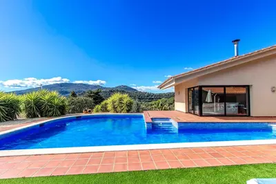 a swimming pool in front of a house at Catalunya Casas Stunning modern villa and just half hour to Barcelona! in Caldes de Montbui