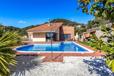 a swimming pool in front of a house at Catalunya Casas Stunning modern villa and just half hour to Barcelona! in Caldes de Montbui