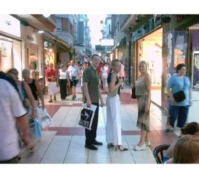 a group of people standing on a city street at CALELLA DE LA COSTA ( Maresme - Costa Brava) in Calella