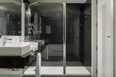 a bathroom with a shower and a sink at Dorma Plaza Catalunya in Barcelona