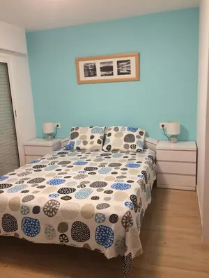 a bedroom with a bed and two night stands at Pis Ocata in Masnou