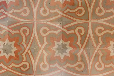 a close up of a tile floor with stars on it at Novus Homes Barcelona Gracia in Barcelona