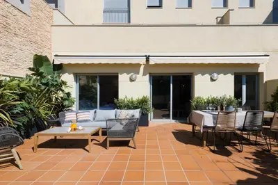 an outdoor patio with a table and chairs at Petit Luxe l'Oasi d'Egara in Terrassa