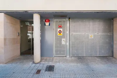 a pair of metal doors in a building at Petit Luxe l'Oasi d'Egara in Terrassa