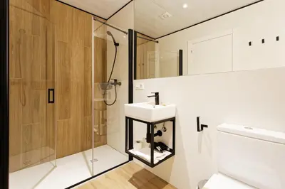 a bathroom with a sink and a shower at Green House Hotel in Barcelona