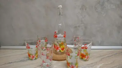 a group of glasses and a bottle on a table at CASA FLAMINGO in Masnou