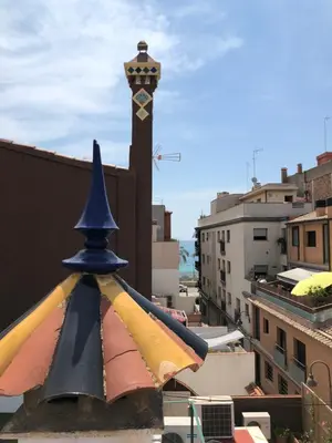 a clock tower on top of a building with at Apartament Can Mateu-Gran Terraza in Vilassar de Mar