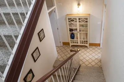 a staircase leading up to a room with a cabinet at Apartament Can Mateu-Gran Terraza in Vilassar de Mar