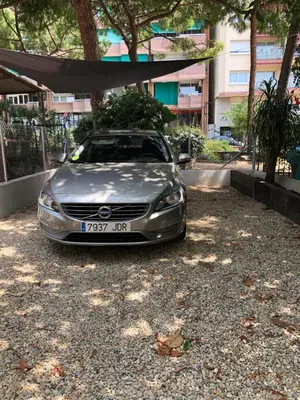 a silver car parked in a gravel parking lot at Apartament Can Mateu-Gran Terraza in Vilassar de Mar