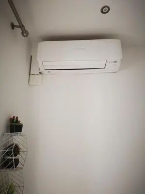 a printer in a corner of a room at Dip2 in Barcelona