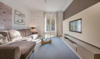 a living room with a couch and a table at You Stylish Diagonal Apartments in Barcelona