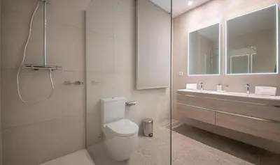 a bathroom with a shower and a toilet and a sink at You Stylish Diagonal Apartments in Barcelona