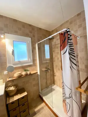 a bathroom with a shower and a sink at Seaside Apartment in Sitges Steps from Beaches with private Patio in Sitges