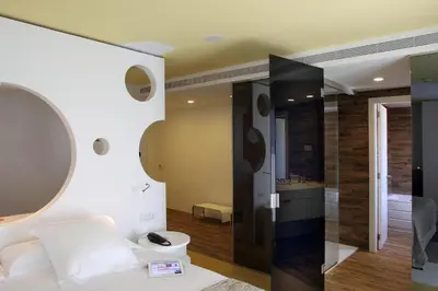 a bathroom with a toilet and a shower in a room at Room Mate Pau, Barcelona in Barcelona
