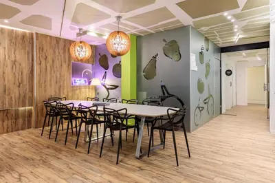 a dining room with a table and chairs at Room Mate Pau, Barcelona in Barcelona