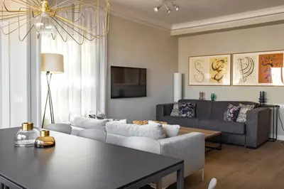 a living room with a couch and a table at Aspasios Rambla Catalunya Apartments in Barcelona