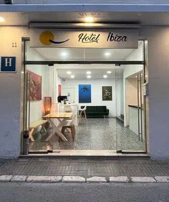 a nikola bilva store with a table in the window at Hotel Ibiza in Sitges