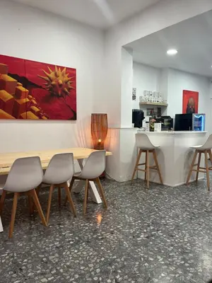 a conference room with a wooden table and chairs at Hotel Ibiza in Sitges