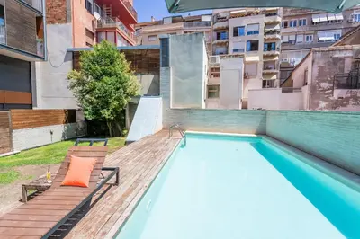 a swimming pool on the roof of a building at My Space Barcelona Pool Garden Apartments in Barcelona