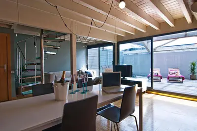 an office with a table with a laptop and chairs at My Space Barcelona Executive Apartments Center in Barcelona