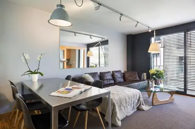 a living room with a table and a couch at My Space Barcelona Executive Apartments Center in Barcelona