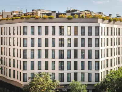 an office building with a lot of windows at Radisson Blu 1882 Hotel, Barcelona Sagrada Familia in Barcelona