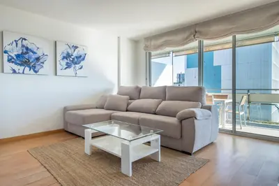 a living room with a couch and a table at Rent Top Apartments Forum in Sant Adria de Besos