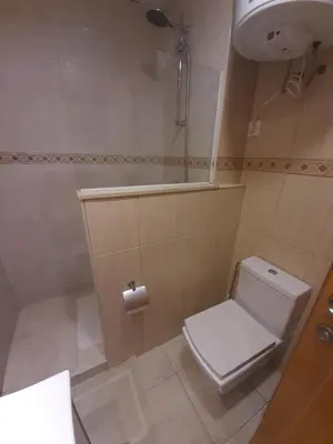 a small bathroom with a toilet and a sink at White Stones Beach In Sant Pol de Mar in San Pol de Mar