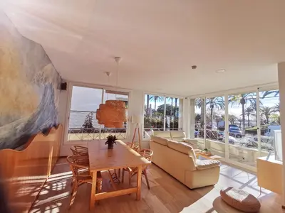 a living room with a table and a couch at MAREA Hotel in Vilanova i la Geltrú