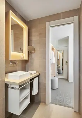 a bathroom with a sink and a mirror at Hotel restaurant Ceferino in Vilanova i la Geltrú