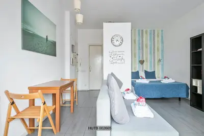a living room with a couch and a table at Alcam Pau Claris in Barcelona