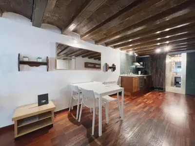 a dining room with a white table and chairs at Stay U-nique Apartments Plaça Universitat in Barcelona
