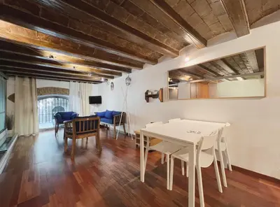 a dining room with a white table and chairs at Stay U-nique Apartments Plaça Universitat in Barcelona