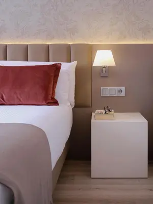a bedroom with a bed and a white nightstand at Musik Boutique Hotel - Solo Adultos in Barcelona