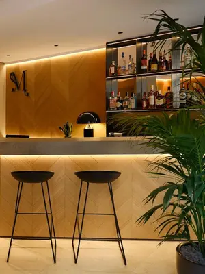 a bar in a restaurant with two stools in front at Musik Boutique Hotel - Solo Adultos in Barcelona