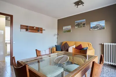 a living room with a glass table and a couch at Manresa Apartamentos Turísticos in Manresa