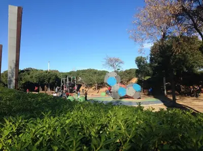 a park with a large elephant balloon in the park at Barcelona Family Beach in Barcelona