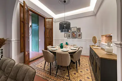 a dining room with a table and chairs at Habitat Apartments Grace in Barcelona