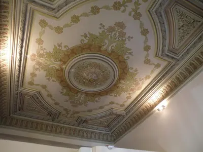 a ceiling with a painting of flowers on it at Hotel Center Gran Via in Barcelona