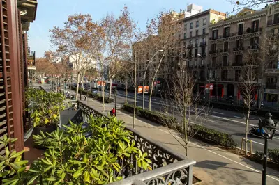a view of a city street with buildings and plants at Hotel Center Gran Via in Barcelona