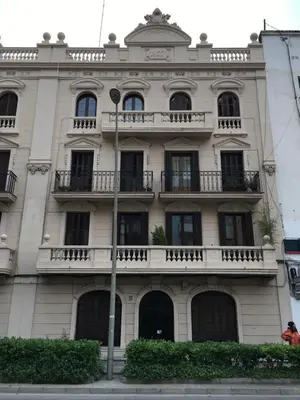 a large white building with windows and balconies at Habitació amb encant in Sitges