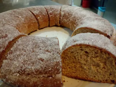 a loaf of bread with powdered sugar on it at Hotel Fonda Neus in Sant Sadurní dʼAnoia