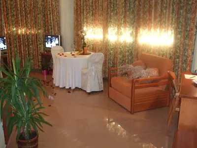 a living room with a table and a couch at Hotel Fonda Neus in Sant Sadurní dʼAnoia