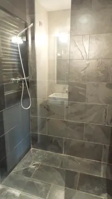 a bathroom with a glass shower with a sink at VILLA DEL BOSQUE in Castelldefels