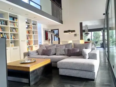 a living room with a couch and a coffee table at VILLA DEL BOSQUE in Castelldefels