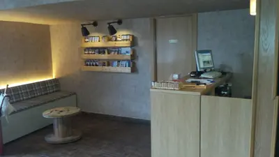 a waiting room with a counter and a desk with a computer at Guilleumes Montserrat in Monistrol