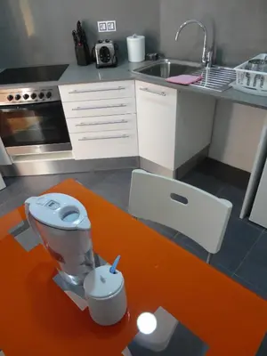 a model of a kitchen with a toilet and a sink at Claris Apartments in Barcelona