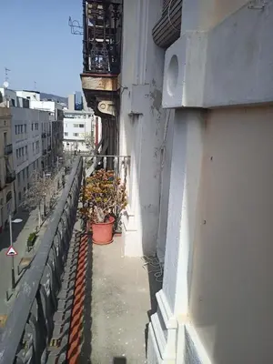 a balcony with potted plants on the side of a building at Fira Plaza España Apartment 3ʳᵈ Floor Balcony in Barcelona