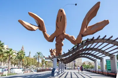 a metal sculpture of a tree on a street at Citytrip Barceloneta Beach in Barcelona