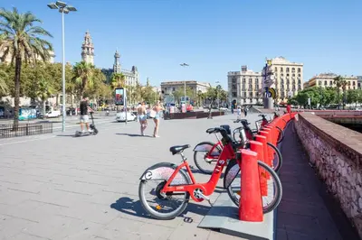 a group of bikes parked next to a wall at Citytrip Barceloneta Beach in Barcelona